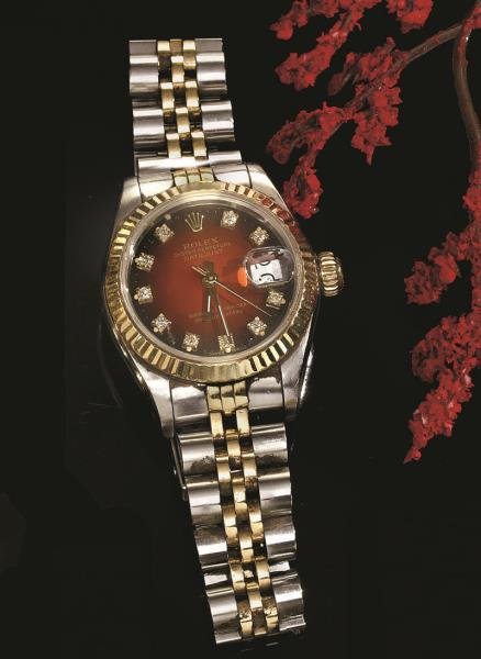 LADY'S DIAMOND DIAL WATCH, ROLEX: Stainless steel and 18k yellow gold oyster perpetual datejust with a carnelian color dial set with diamonds. Running.