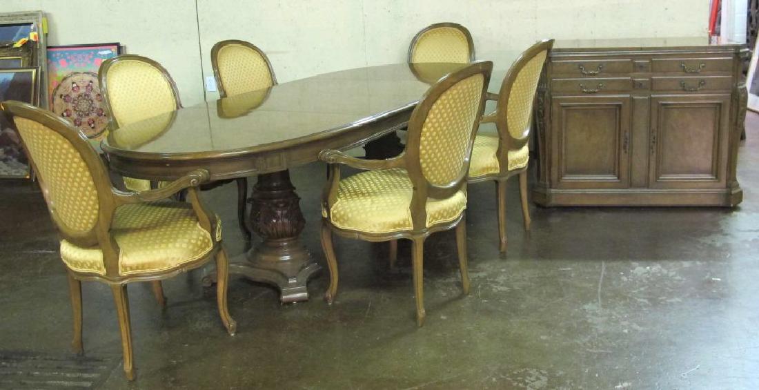 Eight Pce Kargas Dining Room Set: Dining room set including 6 armchairs having carved wood frames and gold foliate upholstery, an oval form wood dining table with carved apron and pedestal base, and a 2 door, 2 drawer wood cabinet wit