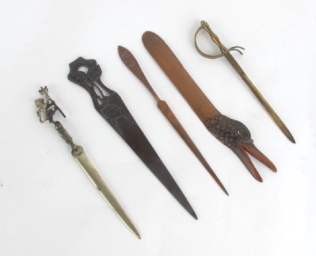 Tiffany Studios Letter Opener and More: Grouping of letter openers including one carved wood duck, one Chicago souvenir, one Tiffany Studios with foliate motif, and more. Various sizes. Various Measurements: Various Notes: Please carefully 