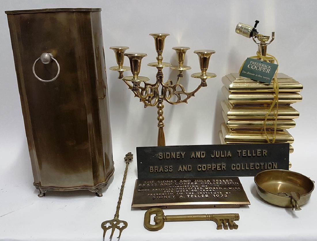 Lot of Brass and Copper Items: Grouping of brass and copper items including a 5 arm brass candlestick, 2 wall plaques, a Frederick Cooper table lamp, a pedestal dish, a large platter, and handles container, and an oversized key. 19