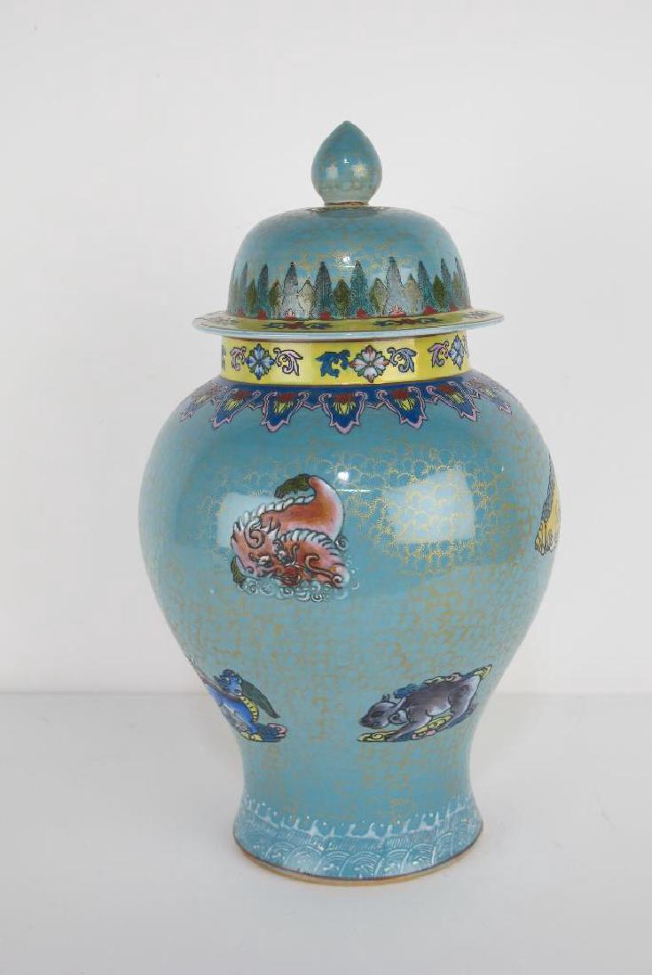 Chinese Lidded Jar: Lidded urn hand painted light blue with animal motif and foliate detail. 17 inches height, 9.5 inches width, 9.5 inches depth. 17"H x 9.5"W x 9.5"D 17"H x 9.5"W x 9.5"D