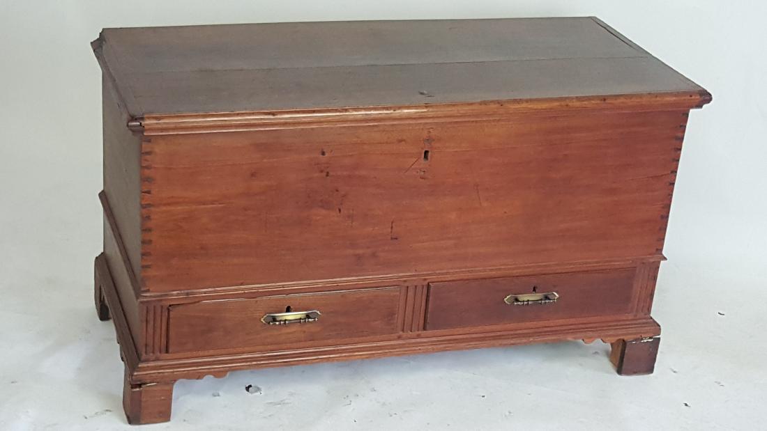 Blanket Chest: Dark wood blanket chest having 2 drawers with dovetail construction and a hinged top with keyhole. Dovetail detail to sides. 28.25 inches height, 51 inches width, 24 inches depth. 28.25"H x 51"W x 24"