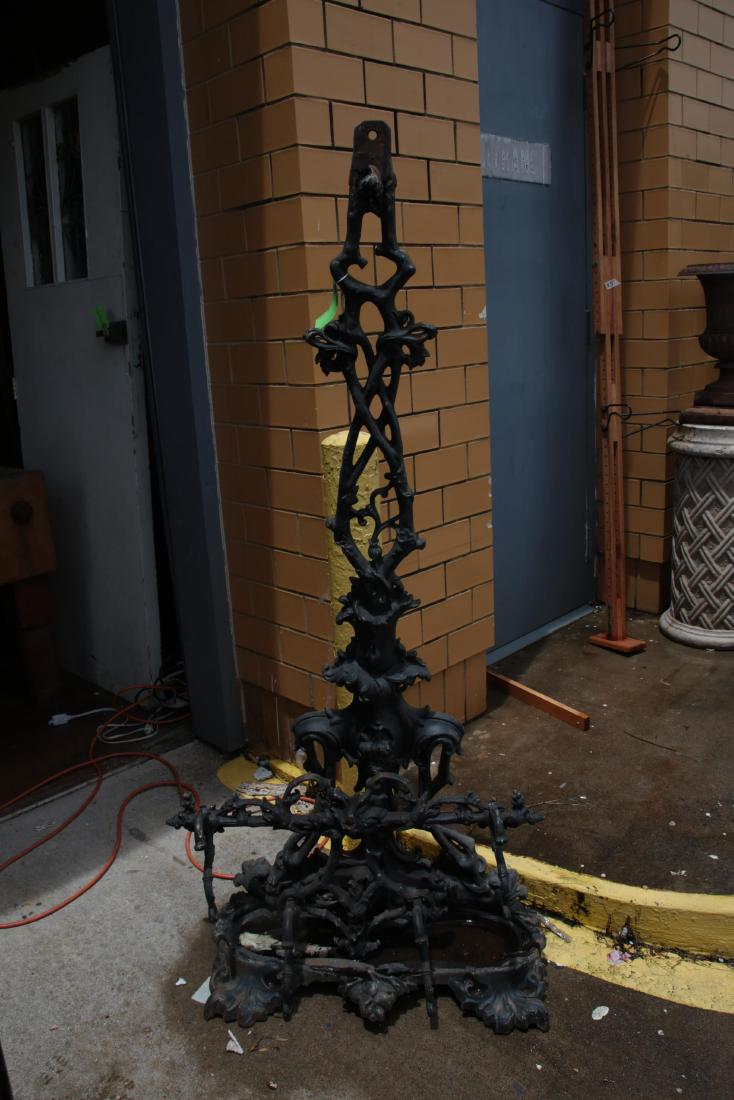 Cast Iron Hall Tree: Cast iron hall tree having foliate motif throughout with hooked piece attaching to top. Wear from age and use. 61.5"H x 25.5"W x 12"D Wear from age and use