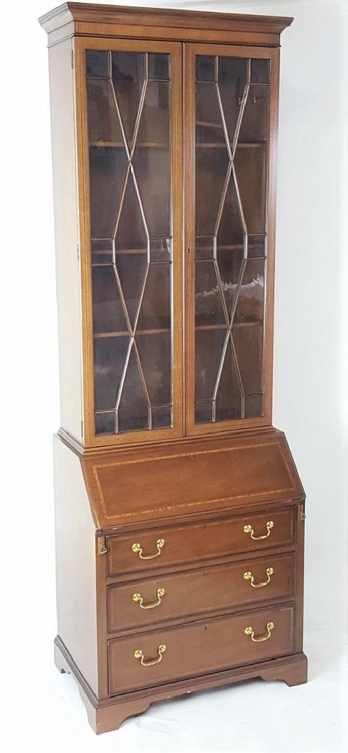 Inlaid Kittinger Federal Style Two Piece Secretary: Secretary having inlaid wood detail and 3 drawers to lower half with brass bail pulls. Two glass-paneled doors to top opening to shelving. 89 inches height, 30 inches width, 20 inches depth. 89"H x 30