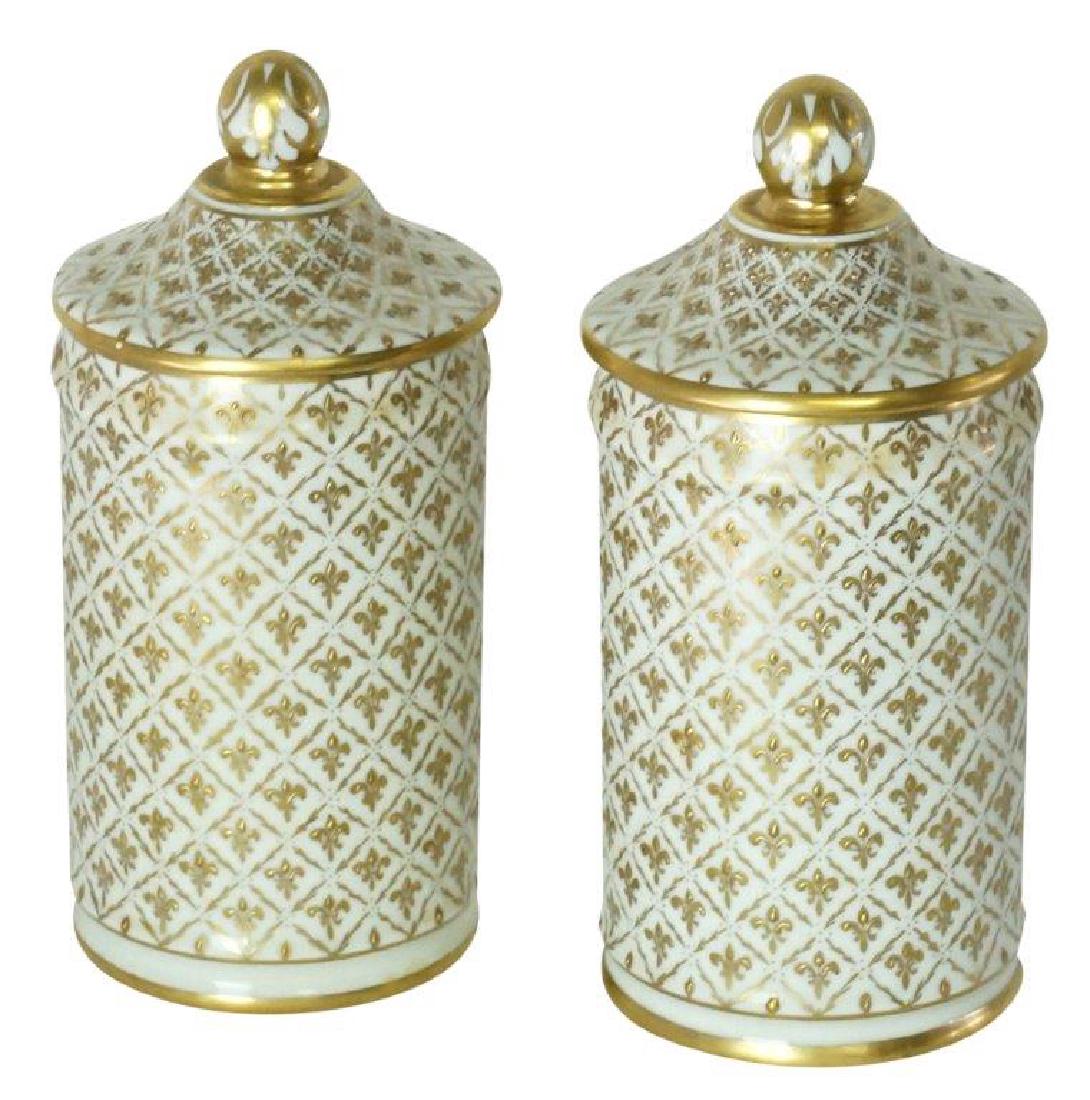 Pair of Lidded Le Tallec Porcelain Jars: Pair of hand painted fleur de lis-patterned lidded jars inscribed in French to bottom. By Le Tallec with mark. 9 inches height, 4 inches diameter. 9"H x 4" diameter