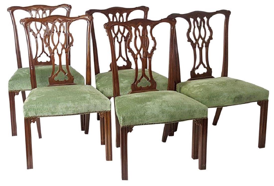 Set of 5 Dining Room Chairs: Set of 5 dining room chairs having open carved backs with foliate detail, straight legs, and green seat upholstery. Wear to seats from age and use. 38 inches height, 24 inches width, 18 inches depth.