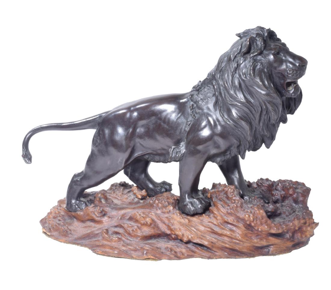 Japanese Meji Bronze Lion: Placed upon a naturalistic wooden base. 12 inches height, 16 inches width, 8 inches depth. 12"H x 16"W x 8"DFor Additional Photos Please follow the linkhttps://www.dropbox.com/sh/4hssx9xvhgprybp/AAClV