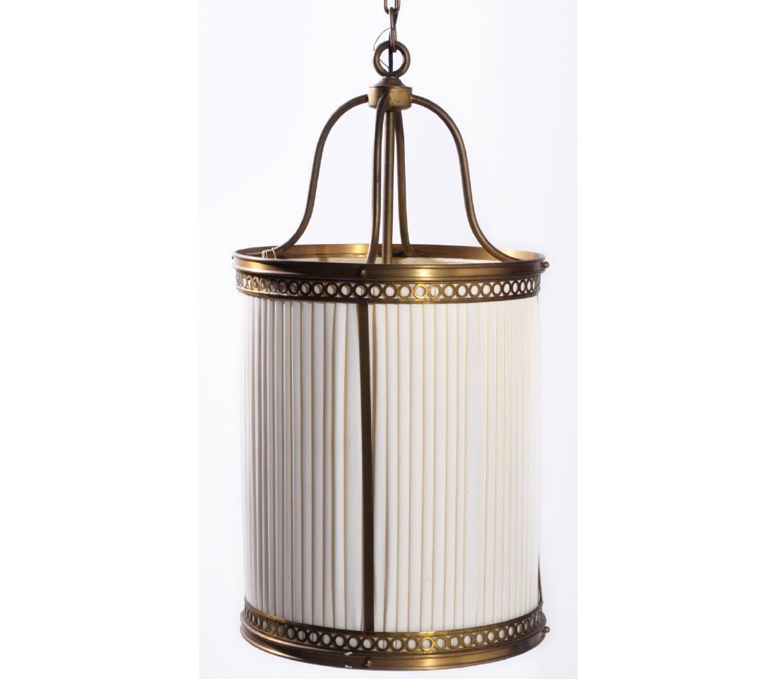 Bronze & Linen Cylindrical Lantern: Round shape bronze lantern with pleaded linen fabric shade. The light fixtures with four arms. Finely constructed. 26"H x 15"W