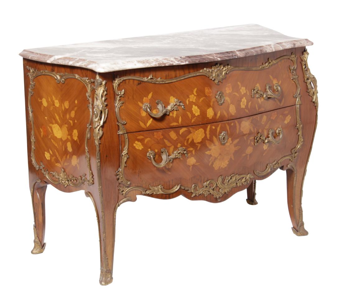 Louis XV Style Fine Commode: 20th C. The pink shaped marble top over three marquetry framed drawers with gilt bronze mounts.