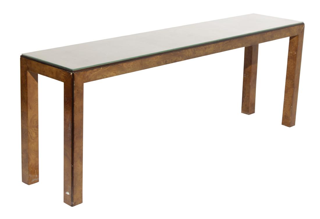 Widdicomb 70's Burlwood Console: Glass covered wooden top oval foursquare Parsons style legs, edges with ebonized molding. Condition commensurate with age and use. 26.75"H x 72"W x 16"D