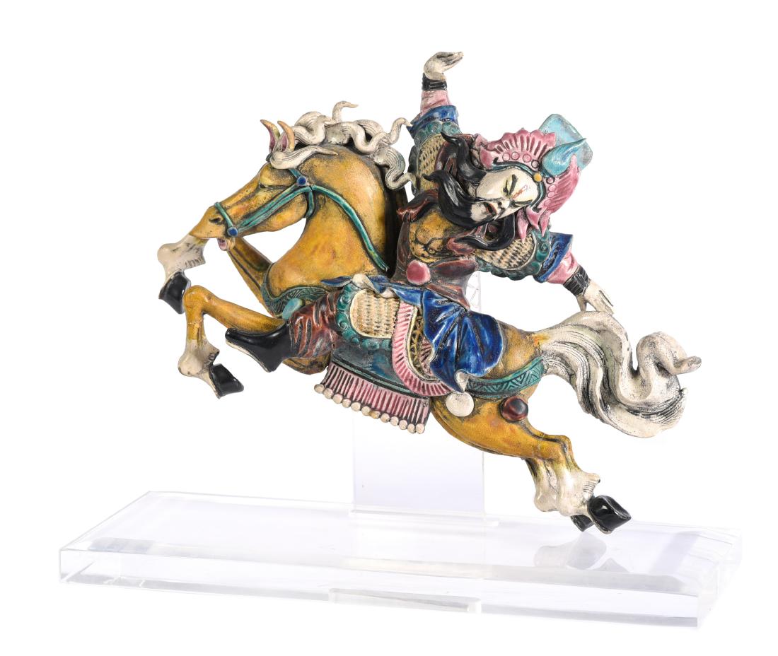 Chinese Roof Tile: Models as a figure of a rider on horseback. Mounted on a Lucite base. Restorations to feet. 12"H x 15"W x 6"D This lot is located at 1502 N Lime Avenue, Sarasota, Florida, 34237. DELIVERY SERVICE TO A