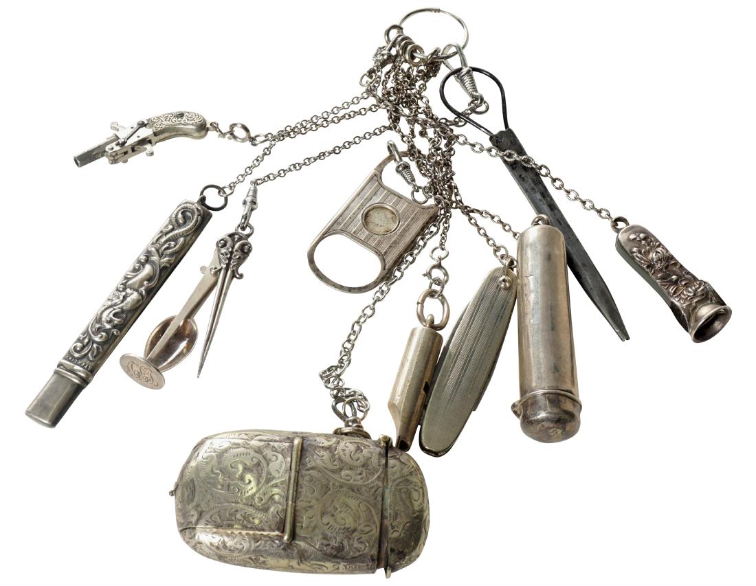 Chatalaine With 10 Implements: Sterling silver and silver plate. Silver matching safe, pocket knife, mini pistol, pipe cleaner, cigar tipper, whistle, and pencil holder. This lot is located at 1502 N Lime Avenue, Sarasota, Florida,