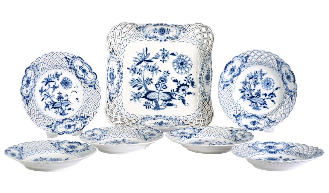 Meissen Blue and White Reticulated Lot Tableware: Including: square serving platter and six matching salad plates. Floral design features pierced woven boarders. Plates vary slightly in size, one plate bears a mark other than First Quality. Platter m