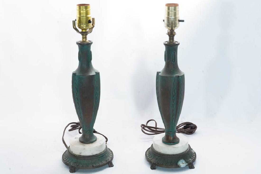 Pair Classical Style Tabletop Lamps: Patinated metal and marble in a classical urn form, both lacking harps. Some tarnish. 15.5"H x 5.5"W x 4.5"D
