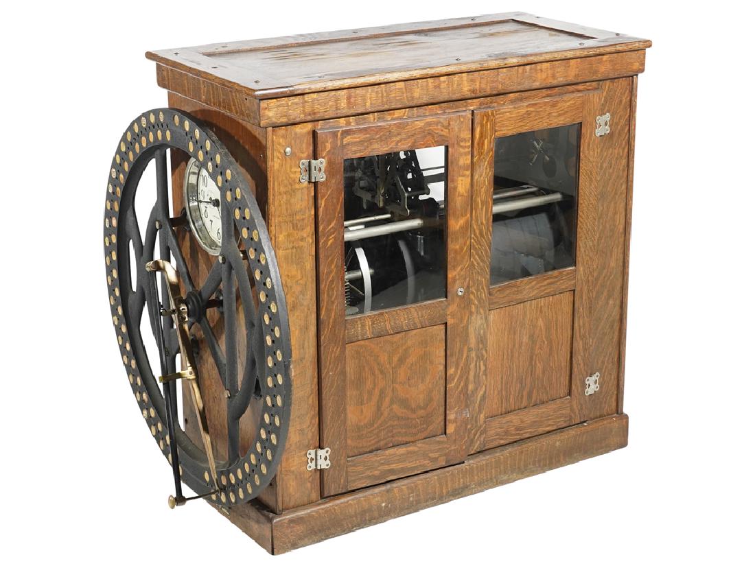 INT'L BUSINESS MACHINE Time Recorder Clock: INT'L BUSINESS MACHINE Time Recorder Clock, 1911, Endicott, New York. 8 day duration time punch clock for 100 employees in a table model oak case. Early wheel mechanism,with works housed in an oak cab