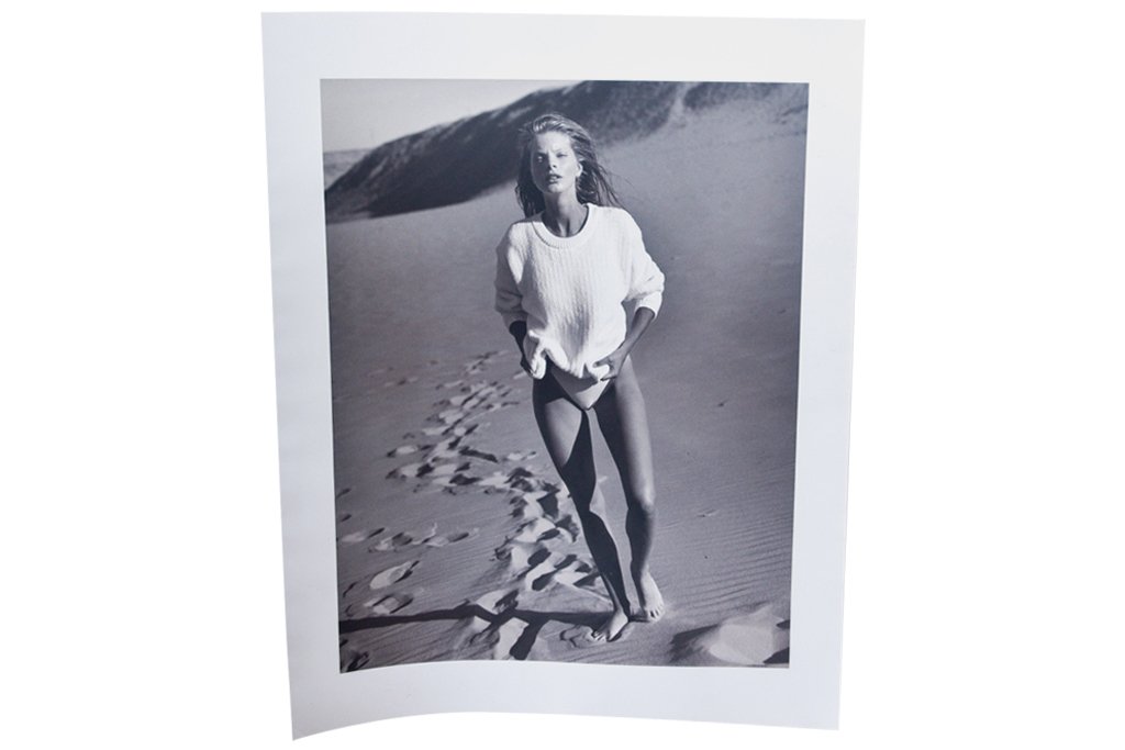Michel Comte (b. 1954) Fashion Photograph: Black and white photograph by Swiss fashion photographer Michel Comte depicting a model walking on the beach. 60"H X 20"W