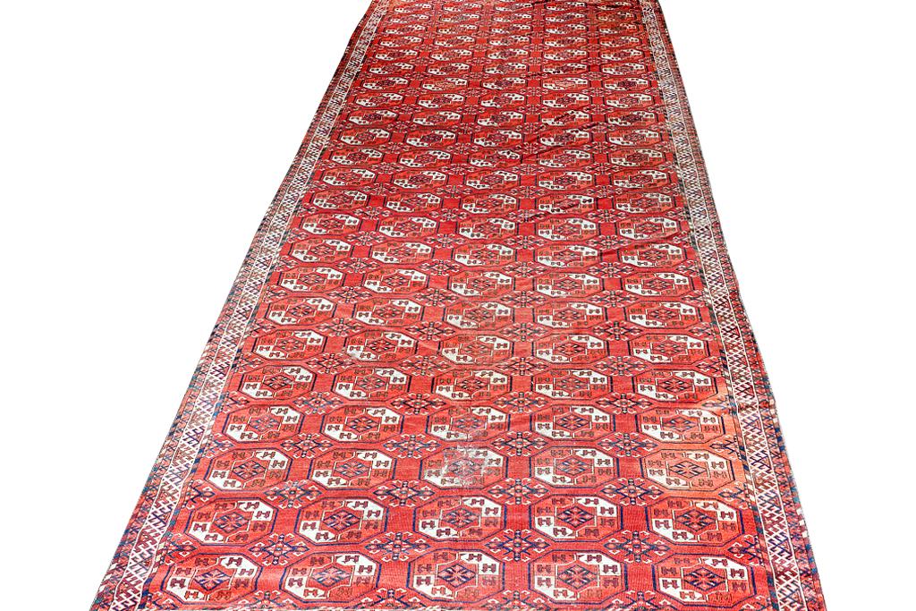 Semi-Antique Turkish Bokaraha: Red ground with repetitive gull motif. 15 feet 2" x 7' Wear commensurate with age and use. 15'2"