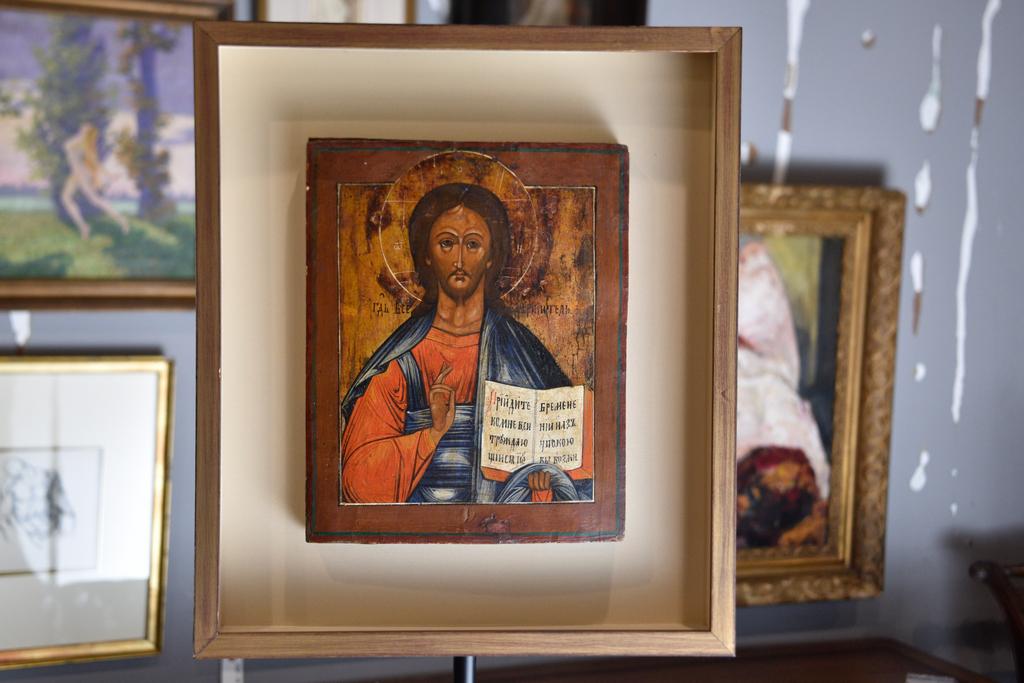 Russian Icon 19th Century: Gold leaf and gesso on wood. Depicting Christ holding the bible. Set in a cotemporary painted wood shadow box. Sight, 16.50"H 19"W. Sight, 10" x 12"W. Overall, 19.25'h x 16.50"W.