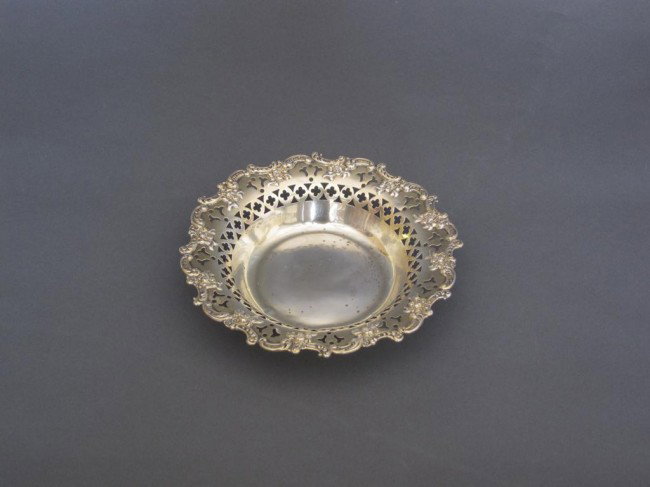 BLACK, STARR, AND FROST STERLING VERMEIL BOWL:: scalloped floral decorated rim with pierced band. Diameter: 6.25". Approximately 3.75" toz. Ding to base.