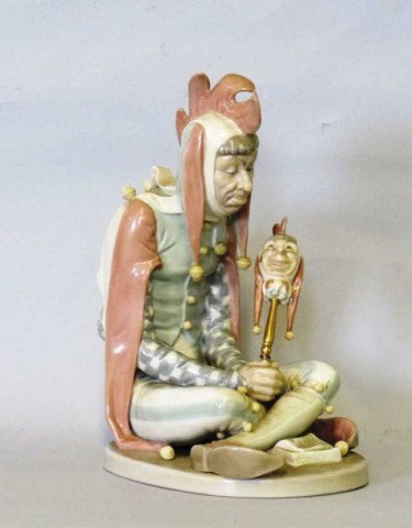 LLADRO PORCELAIN JESTER FIGURE:: From the Norman Rockwell collection of Lladro porcelains, depicting a sitting jester. 494/1000. 7.5"W X 9"H
