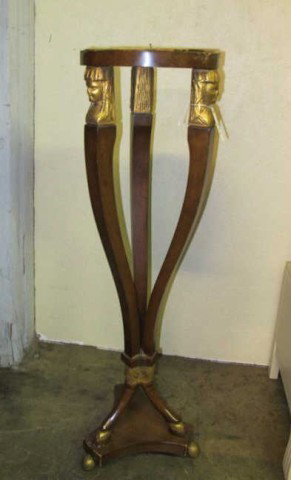 EMPIRE STYLE FIGURAL CARVED PEDESTAL:: Having a circular surface supported by 3 carved and gilt figural supports, on 3 tapering legs ending in cloven hoof feet. Note: Missing original surface. 39.5"H X 11.5"diameter