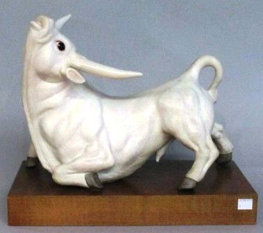 WHITE CYBIS BISQUE PORCELAIN BULL: Mounted on a wooden plinth. Signed and dated 84. 11"HX 12"W Provenance: The Ferst estate