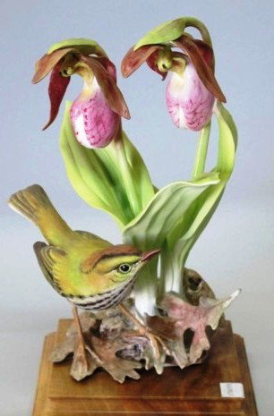 ROYAL WORCESTER - DOUGHTY BIRD "OVEN BIRD":: An oven bird figure modeled by Dorothy Doughty, with lady slipper orchids. Accompanied with fitted wooden base and original box. 11"H Provenance: The Ferst estate