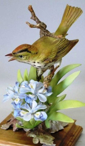 ROYAL WORCESTER - DOUGHTY BIRD "OVEN BIRD":: A figure modeled by Dorothy Doughty depicting an oven bird with crested iris flowers. 11"H with fitted wooden base. Accompanied with original box. Provenance: The Ferst estate