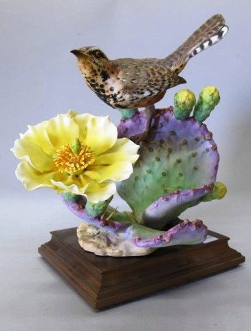 ROYAL WORCESTER - DOUGHTY BIRD "CACTUS WREN":: A bird modeled by Dorothy Doughty perched on a flowering cactus. Accompanied with a fitted wooden base and original box. 11"H Provenance: The Ferst estate