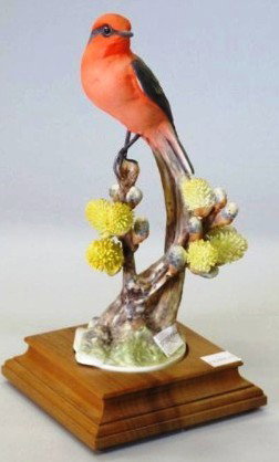 ROYAL WORCESTER - DOUGHTY "VERMILIAN FLY CATCHER":: A figure of a red bird with pussy willow modeled by Dorothy Doughty. Accompanied with a fitted wooden base and box. 10"H Provenance: The Ferst estate