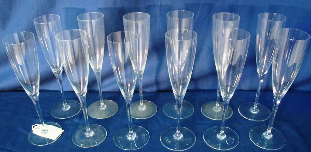 12 BACCARAT "DOM PERIGNON" CHAMPAGNE FLUTES: All signed. No chips or cracks. 9.25"H Provenance: From a fine Buckhead home