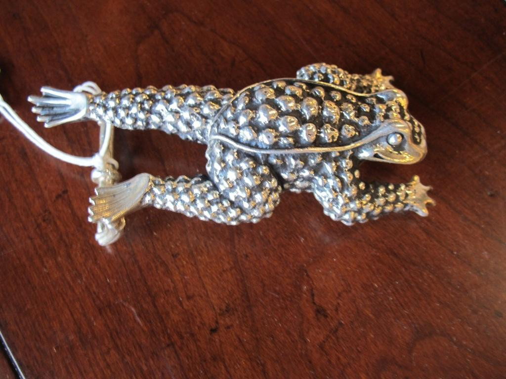 A KIESELSTEIN CORD STERLING SILVER BELT BUCKLE:: In the form of an outstretched frog unmarked sterling. Stamped in verso with makers mark on one leg. 4.35 toz 4.50' L Provenance: Property from a fine Manhattan gentleman