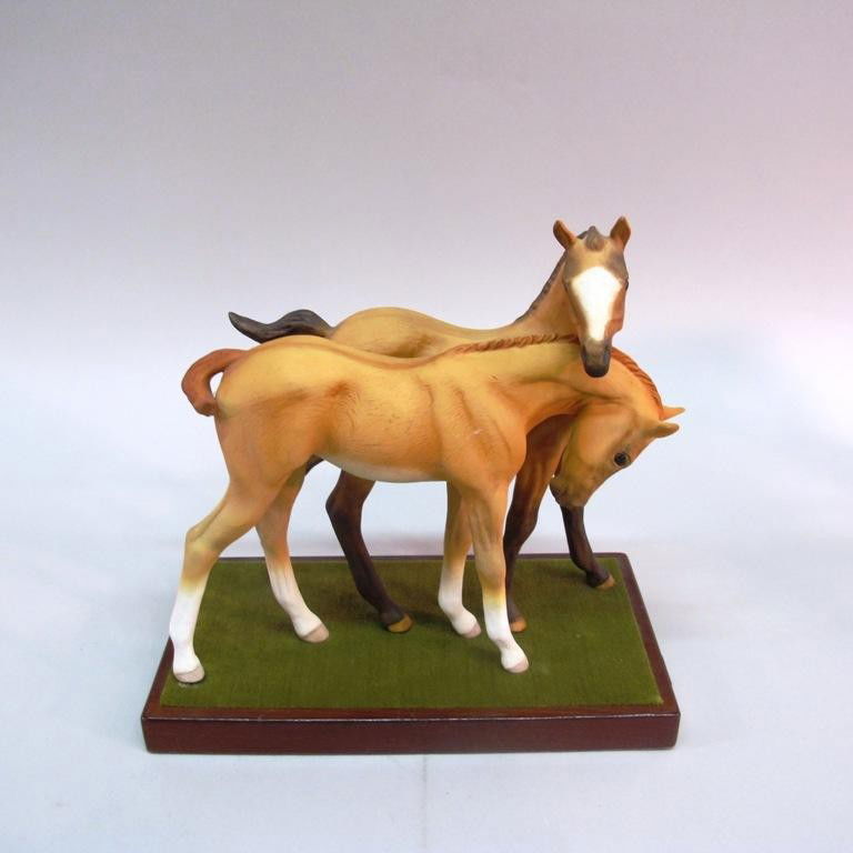 CYBIS HORSE FIGURAL GROUP: A figural group of two foals, measuring. Mounted on a rectangular wooden plinth. Signed. 9.5"H X 9.5"W Provenance: The Ferst estate