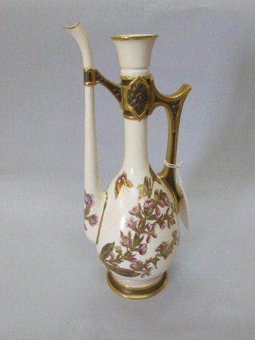 ROYAL WORCESTER PORCELAIN EWER:: A porcelain ewer with a long and slender spout and neck connected by a gilt handle, with hand painted flower and butterfly decoration. Stamped on underside, and having impressed numbers 168. Very good