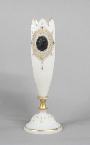 OPALINE GLASS VASE:: An opaline glass vase on a circular foot with gilt decoration and trim and an applied raised black cameo. 13.5"H