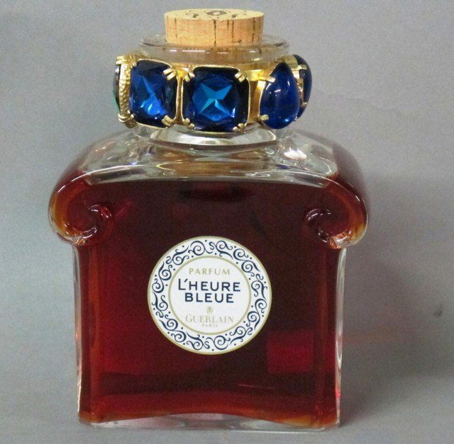 LIMITED EDITION L'HEURE BLEUE BY GUERLAIN PERFUME:: L'Heure Bleue perfume by Guerlain in a Baccarat crystal flacon embellished with brilliant blue square and heart shaped Swarovski crystals. Sealed with a monogrammed cork. 450 ml.