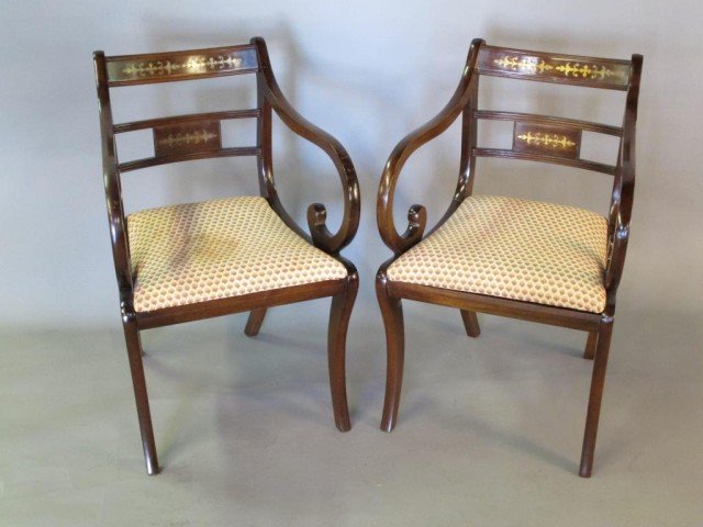 PAIR BRASS INLAID KLISMOS CHAIRS: Brass inlaid designs to the back rests. Wide curved arm rests, and needlepoint seats.
