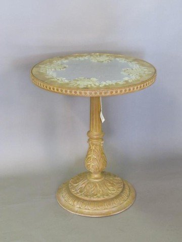 MIRROR TOP CARVED SIDE TABLE:: A circular gilt and silver reflective surface with a hand painted floral border, over a carved column base with foliate and egg and dart details. 27.5"H X 23.5"diameter