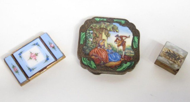 GROUP 3 ANTIQUE LADIES NECESSAIRES:: An enameled continental silver compact depicting a serenade genre scene in a garden. A powder blue compact with pink rose decoration. A mother of pearl pill box (Note: losses). The larger compact meas