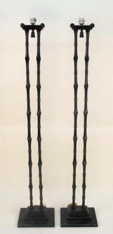 PAIR JAMES MONT FLOOR LAMPS:: A pair of one light floor lamps in the form of two black iron bamboo columns. 63"H