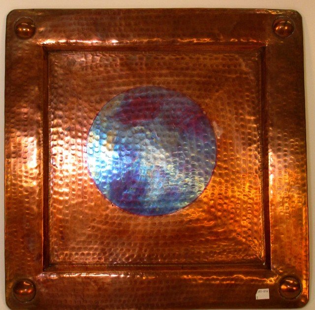 ARTS & CRAFTS STYLE COPPER SERVING TRAY: A large hand hammered copper serving tray, the corners each having raised spherical medallions. Unsigned. 18"X 19"