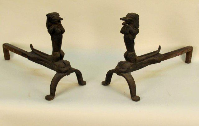 PAIR IRON DOG FORM ANDIRONS: A pair of andirons in the form of dachshunds standing on their hind legs.