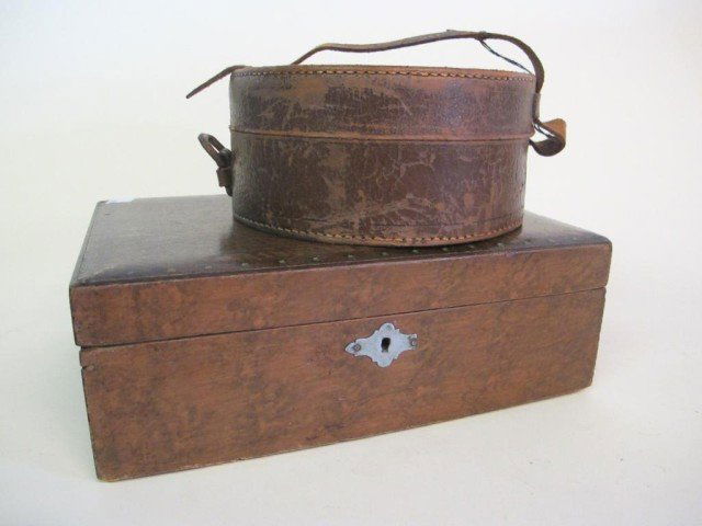 TWO ANTIQUE BOXES: Circa 1910. A leather monogrammed collar box, and a decorative painted top wooden keepsake box.