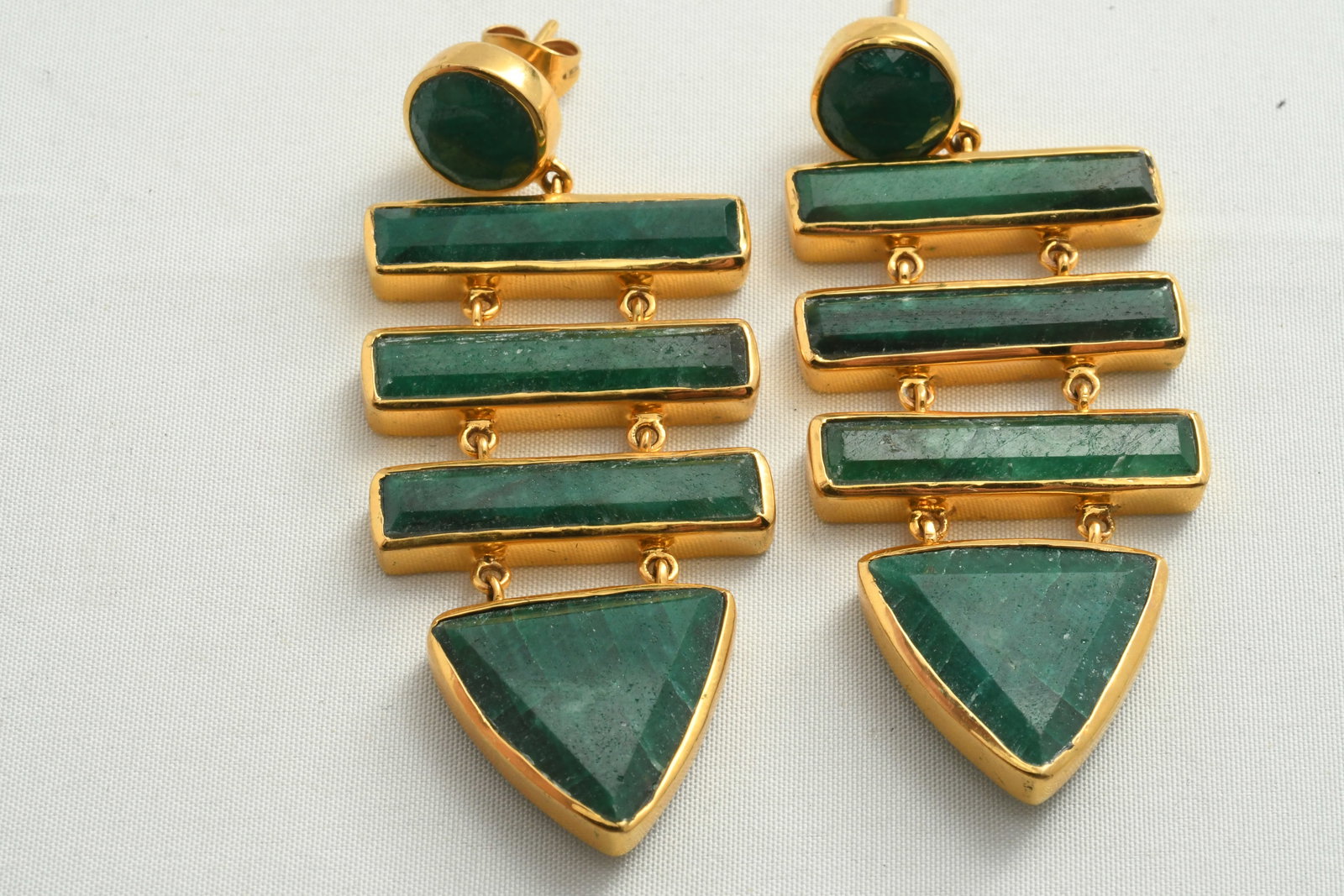 Pair 18K and Natural Emerald Pendant Earrings: Each with three gold framed emerald bars above a triangular gold framed emerald pendant2.5