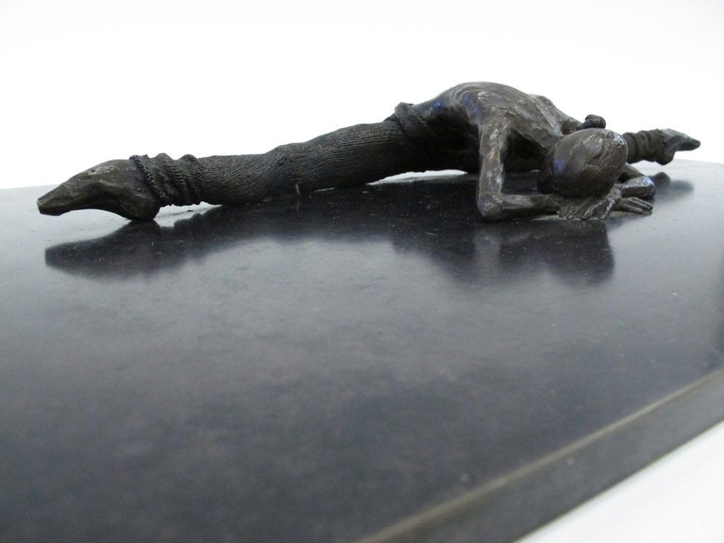 AL FARROW (AMERICAN, B. 1943): A bronze figure of a ballerina stretching, with legs spread and toes pointed, back slightly arched, and forearms and head reading on the ground. Signed on side of base "Al Farrow A/P 1983". Figure mea
