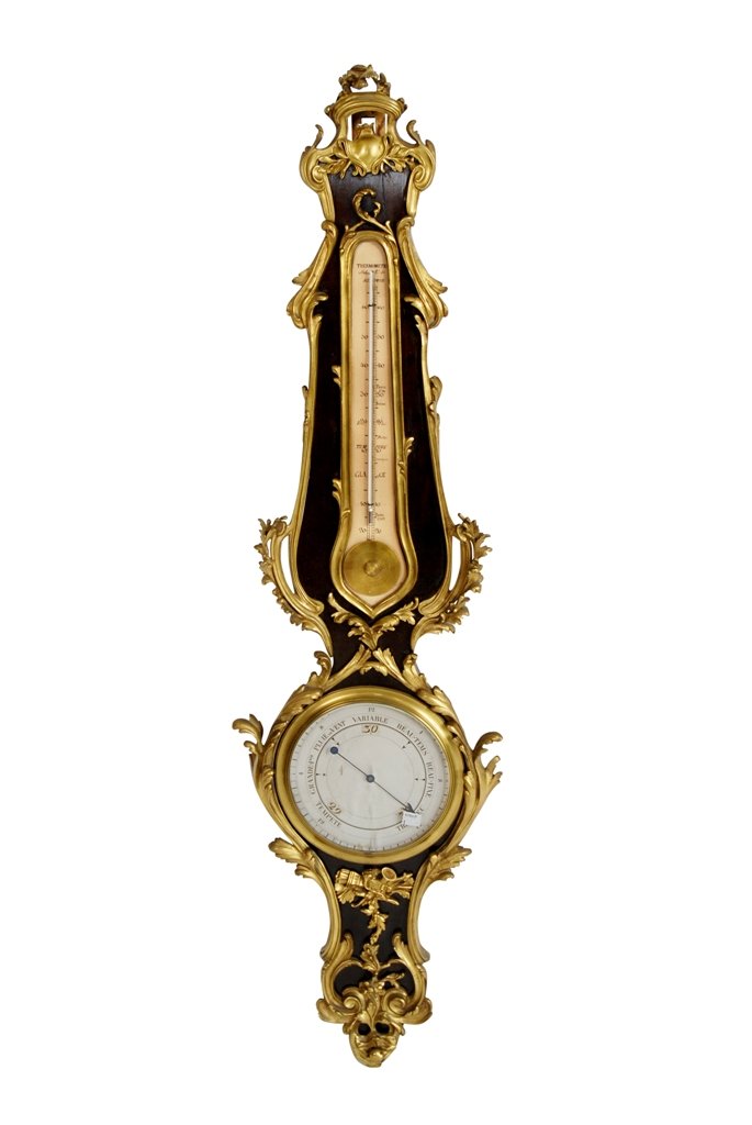 ANTIQUE FRENCH ORMOLU MOUNTED BAROMETER: A mahogany banjo form barometer and thermometer, having heavy ormolu leaf scroll mounts, and signed Mr. de Selon, Paris, 1709. 44.5"H X 2"D X 12"W