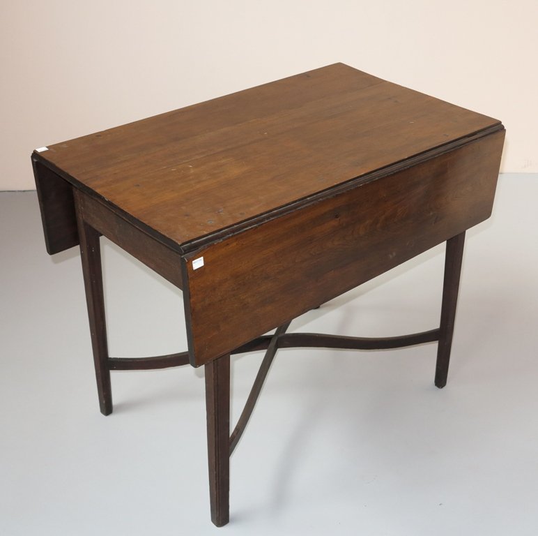 18THC./EARLY 19TH C. PEMBROKE TABLE: American Cherrywood drop leaf table. The rectangular top, having hinged rectangular drop leaves, raised on chambered square tapering legs having a curved "x" center stretcher support. 27.25"HX33.25"DX