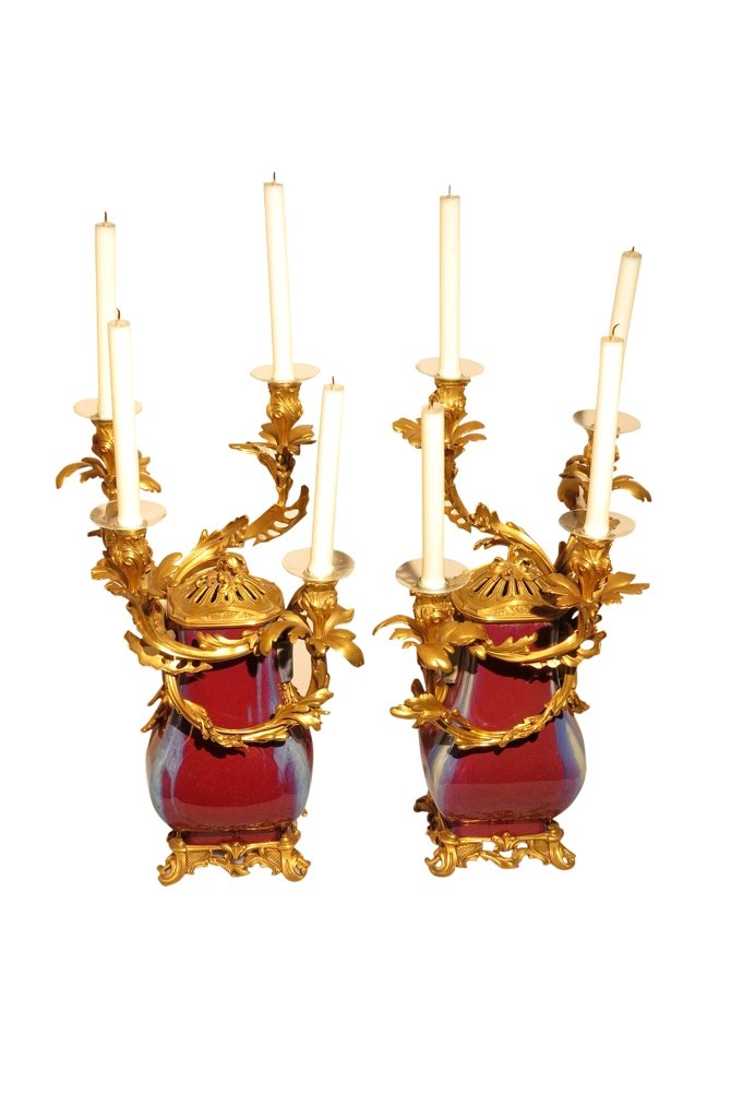 QUING DYNASTY SANGUE DE BOEUF VASES:: Daoguang (1821-1850) The Daoguang seal mark, and of the period, with French gilt bronze mounts. Each as candelabra, having four arms and fitted with reticulated lids. Each bears character marks to the