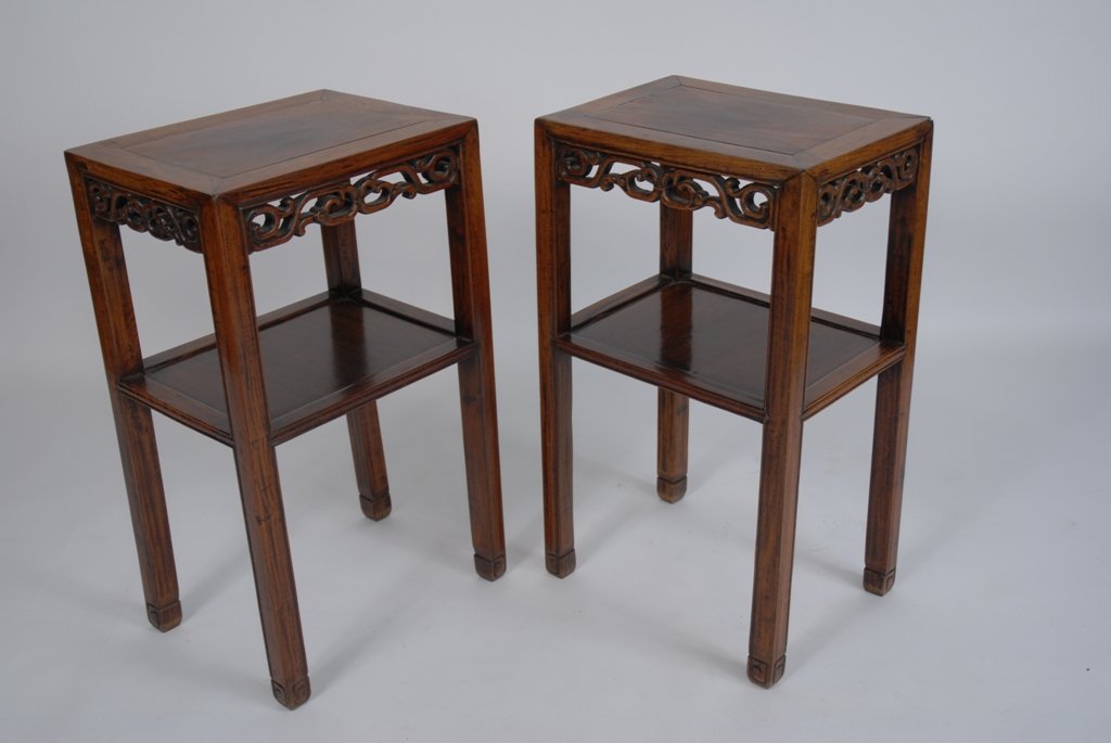 PAIR ANTIQUE CARVED CHINESE TEAK SIDE TABLES: The rectangular form tables each having pierced carved aprons and lower shelves, raised on square form legs. Good condition. 27.5"H X 12"D X 16"W