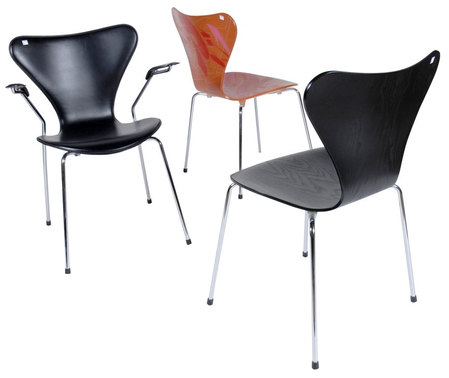 GROUP 6 CHAIRS BY ARNE JACOBSEN FOR FRITZ HANSEN: Six Danish mid-century modern chairs designed by Arne Jacobsen for Fritz Hansen. Including a black arm chair, and five classic form stackable chairs with chrome legs in various colors. All marked with